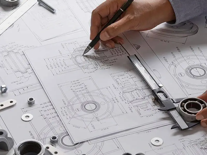 Reviewing fabrication drawings during project consultation at Tuff Industries